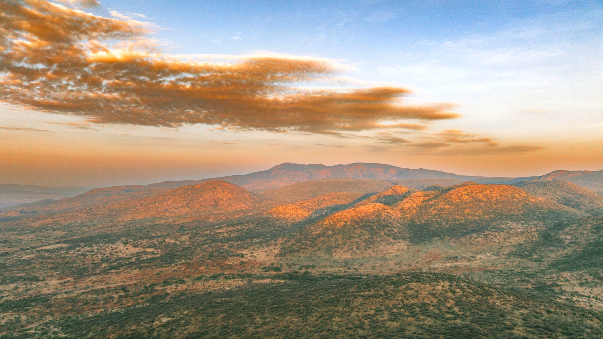 Sunrise over the rolling hills surrounding Enkaji Resort